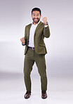 Business man, fist pump and celebrate success or winning portrait in studio on a gray background. Asian male entrepreneur with hands to cheer as winner for growth, bonus or finance profit achievement