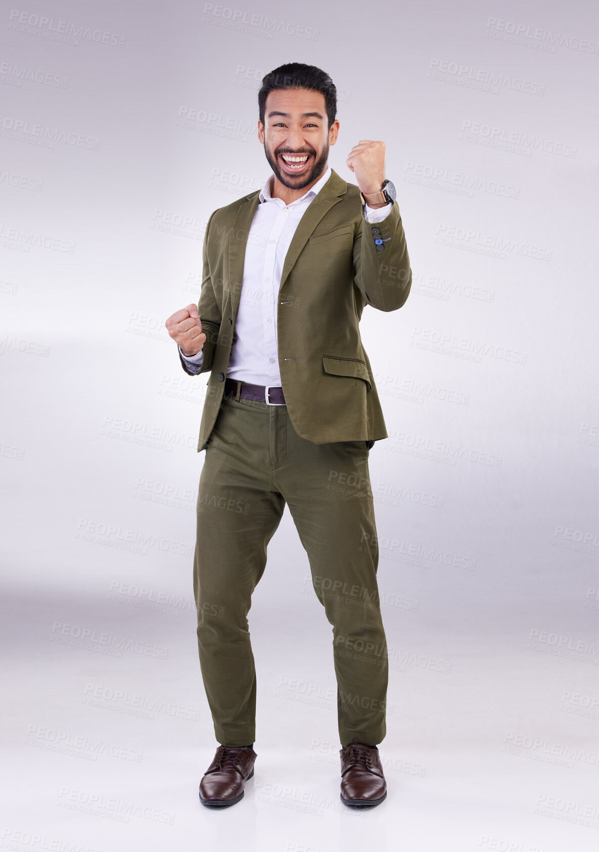 Buy stock photo Business man, fist pump and celebrate success or winning portrait in studio on a gray background. Asian male entrepreneur with hands to cheer as winner for growth, bonus or finance profit achievement