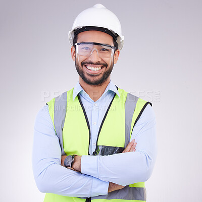 Buy stock photo Construction worker in portrait, man with crossed arms and smile, architect or engineer in building industry on studio background. Happy contractor, professional builder with helmet and goggles 