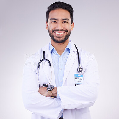 Buy stock photo Doctor, man with arms crossed and happy in portrait, health and medical professional on studio background. Male physician, cardiovascular surgeon with stethoscope, happiness in medicine and mockup