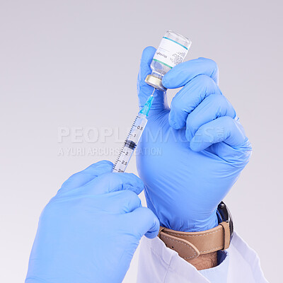 Buy stock photo Hands, vaccine and healthcare with a doctor in studio on a gray background holding monkeypox treatment. Medical, innovation and insurance with a medicine professional ready to administer a cure