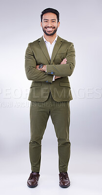 Buy stock photo Business man, smile and arms crossed portrait in studio with pride for career or job on gray background. Asian entrepreneur person with dedication and ambition for professional occupation and mindset