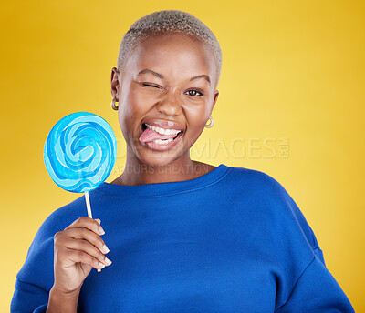 Buy stock photo Portrait, funny and black woman with lollipop, candy and happiness against a studio background. Face, African American female and lady with sweets, dessert and treats with silly, goofy and cheerful