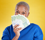 Money winner, portrait and black woman with euros in studio isolated on a yellow background. Financial freedom, wealth and face of rich female with cash after winning lottery, prize or competition.