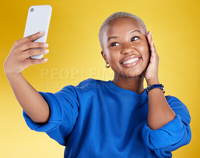 Buy stock photo Smile, selfie and beauty of black woman in studio isolated on a yellow background. Photographer, social media and African female model taking pictures or photo for profile picture and happy memory.