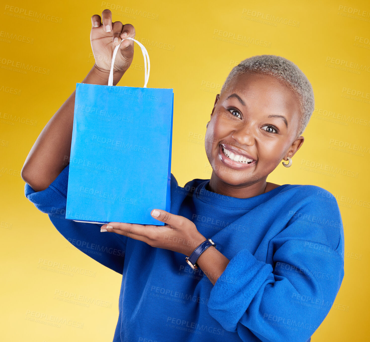 Buy stock photo Gift, present and portrait of black woman holding prize excited and happy isolated in a studio yellow background. Joyful, shopping bag and young female person 