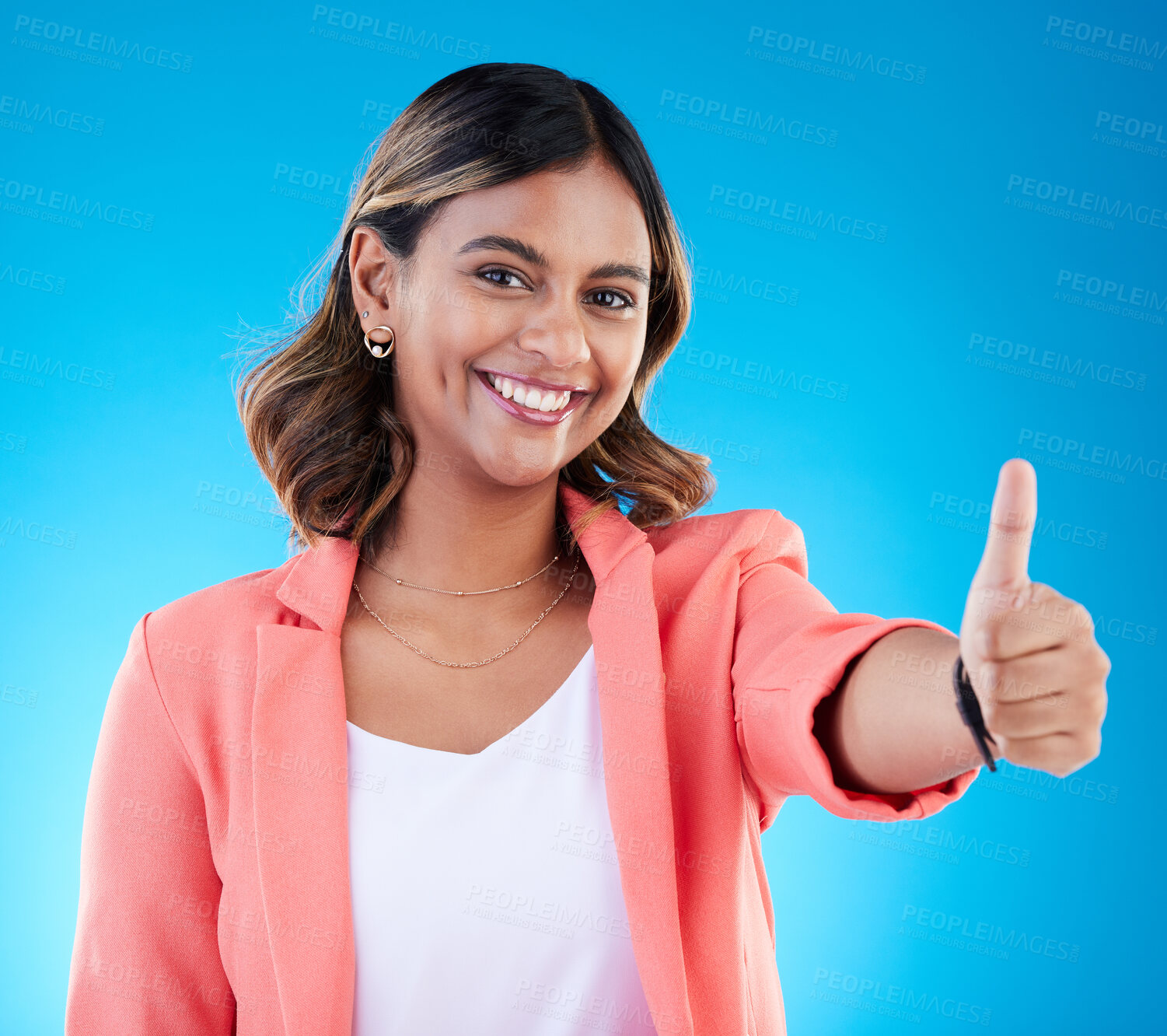 Buy stock photo Smile, portrait and business woman with thumbs up in studio isolated on blue background. Face, success emoji and happy Indian female with hand gesture for thank you, approval or agreement, like or ok