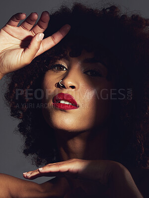 Buy stock photo Red lipstick, shadow and makeup on black woman with beauty, afro or natural hair in studio. Face of aesthetic female model with a skin glow, shine and color on lips for art, power and facial skincare