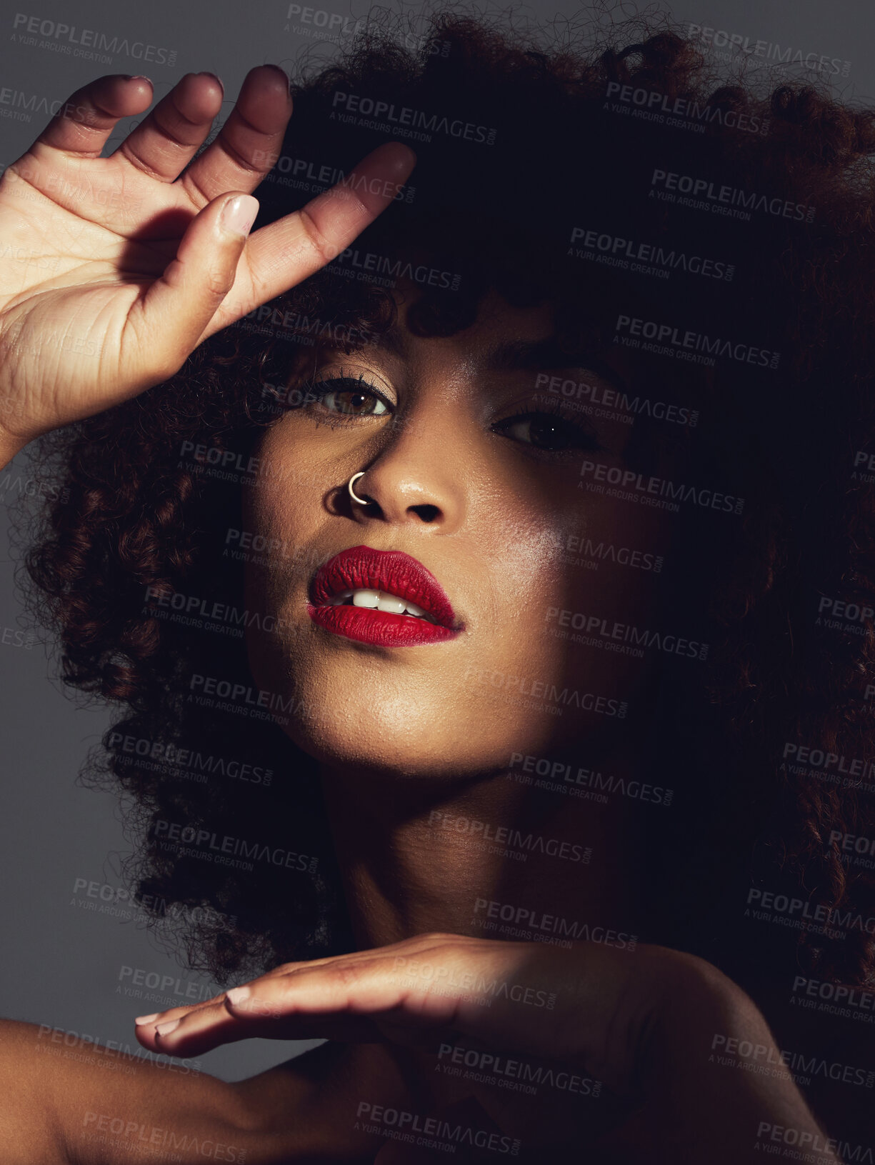 Buy stock photo Red lipstick, shadow and makeup on black woman with beauty, afro or natural hair in studio. Face of aesthetic female model with a skin glow, shine and color on lips for art, power and facial skincare