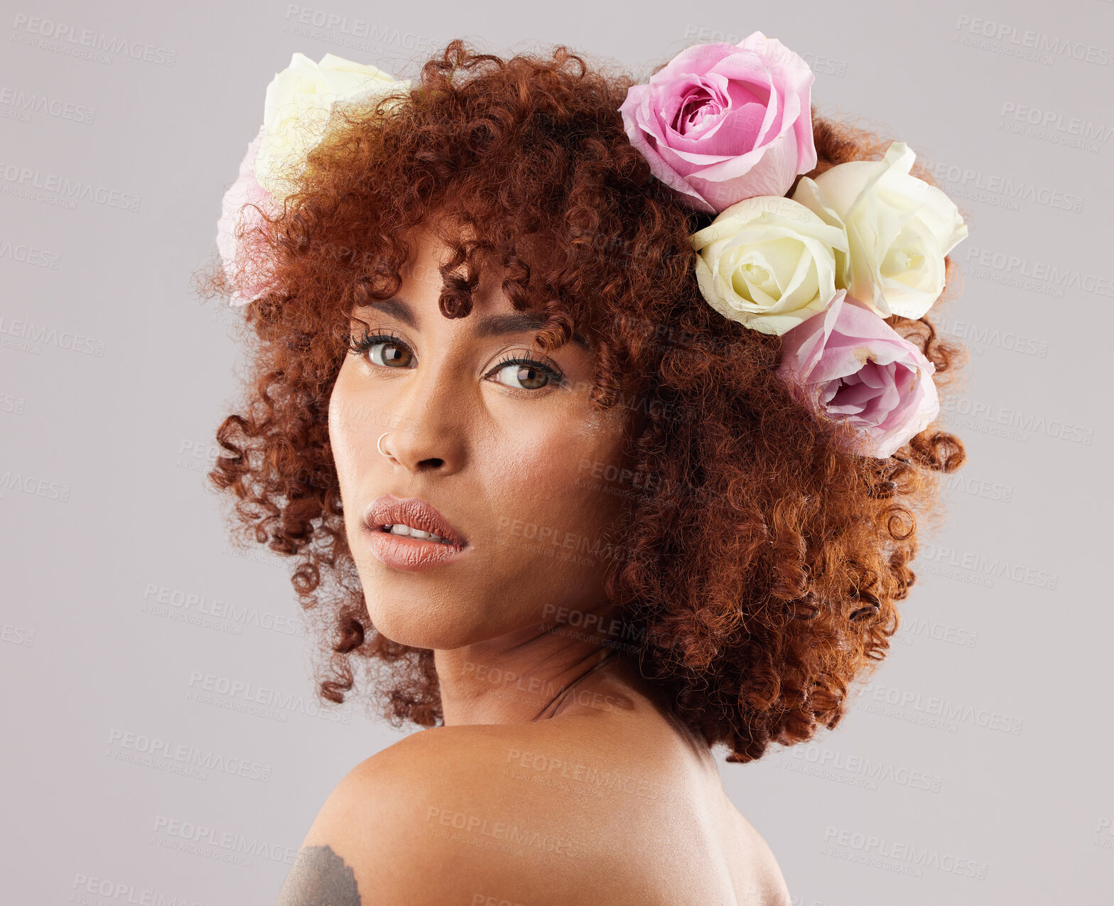 Buy stock photo Portrait, beauty and flowers with a model black woman in studio on a gray background for natural skincare. Wellness, luxury and face with an attractive young female wearing a flower crown or wreath