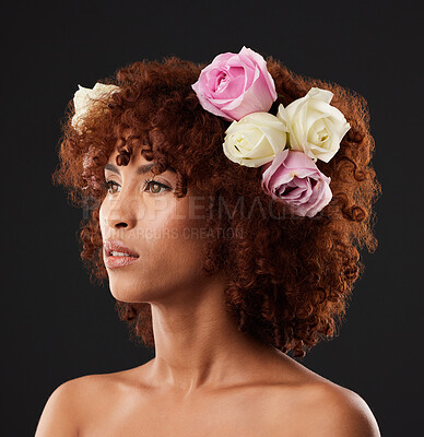 Buy stock photo Thinking, beauty and flowers with a model black woman in studio on a dark background for natural skincare. Wellness, luxury and idea with an attractive young female wearing a flower crown or wreath