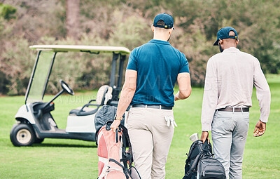 Buy stock photo Golf, sports and men on course with golfing bag walking to cart after game, practice and training on lawn. Professional golfers, fun and back of friends on grass for exercise, fitness and competition