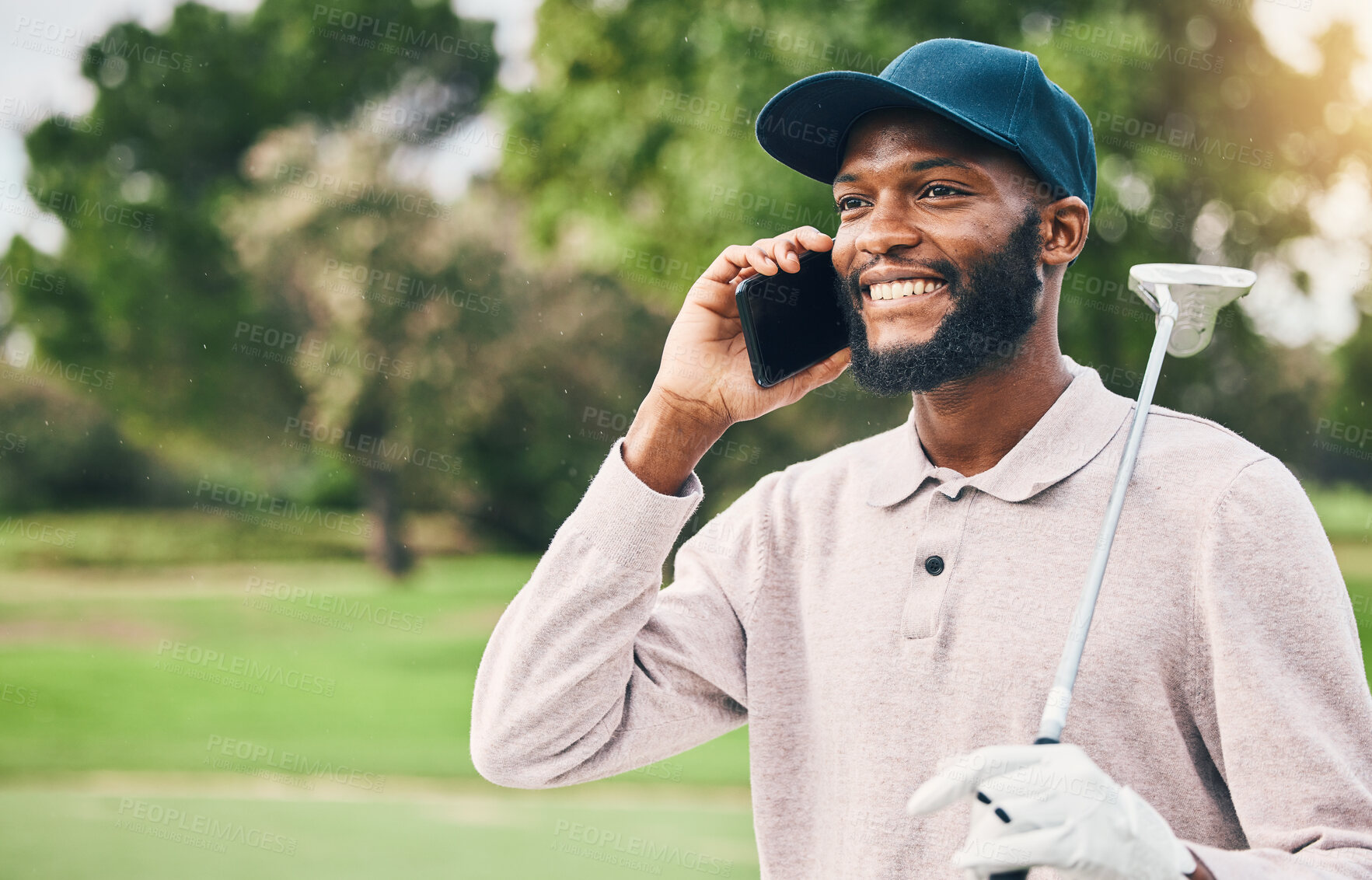 Buy stock photo Black man, phone call and communication on golf course for sports conversation or discussion outdoors. Happy African male smiling and talking on smartphone while golfing for sport hobby in nature