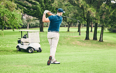 Buy stock photo Golf, stroke and grass with a sports man swinging a club on a field or course for recreation and fun. Golfing, hobby and training with a male golfer playing a game on a green during summer