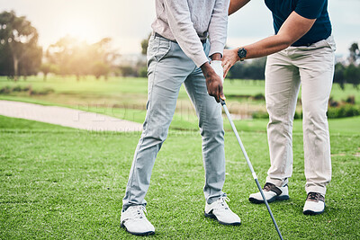 Buy stock photo Golf lesson, sports teaching and coach hands helping a man with swing and stroke outdoor. Lens flare, green course and club support of a athlete ready for exercise, fitness and training for a game