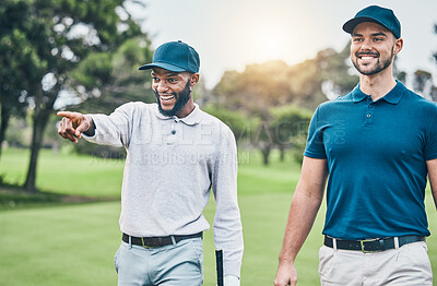 Buy stock photo Friends, men on golf course and black man pointing, walking and talking on grass at game. Health, fitness and friendship, happy golfer man and friend with smile walk in nature on weekend together.