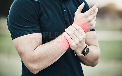 Buy stock photo Sport, injury and golf, man with wrist pain during game on course, massage and outdoor relief in health and wellness. Green, hands on arm in support and golfer with ache from swing in golfing workout