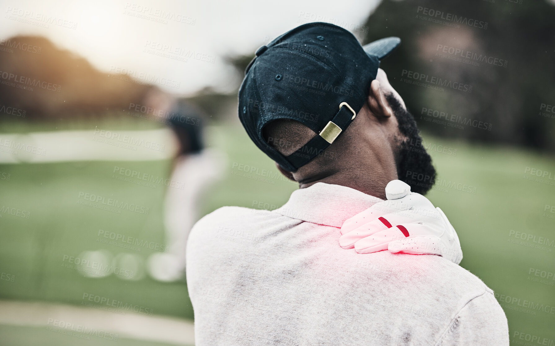 Buy stock photo Sports, injury and golf course, black man with shoulder pain during game, massage and relief in health and wellness. Green, hands on muscle in support and golfer with body ache during golfing workout