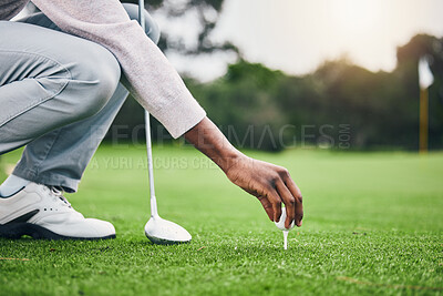 Ready, golf ball and tee with hand of black man on field for training, tournament and challenge. Start, competition match and sports with athlete and club on course for action, games and hobby