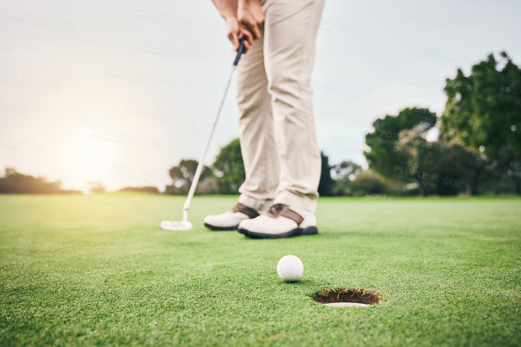 Buy stock photo Golf stroke, sport putt and golfer hands in game, fitness and exercise on grass with a swing. Athlete, lens flare and man at sports club for training and workout on green course with focus and action