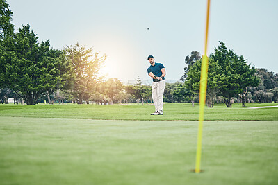 Buy stock photo Grass, golf hole and man with golfing club on course for game, practice and training for competition. Professional golfer, sports and male athlete hit ball with club for winning, score or tee stroke