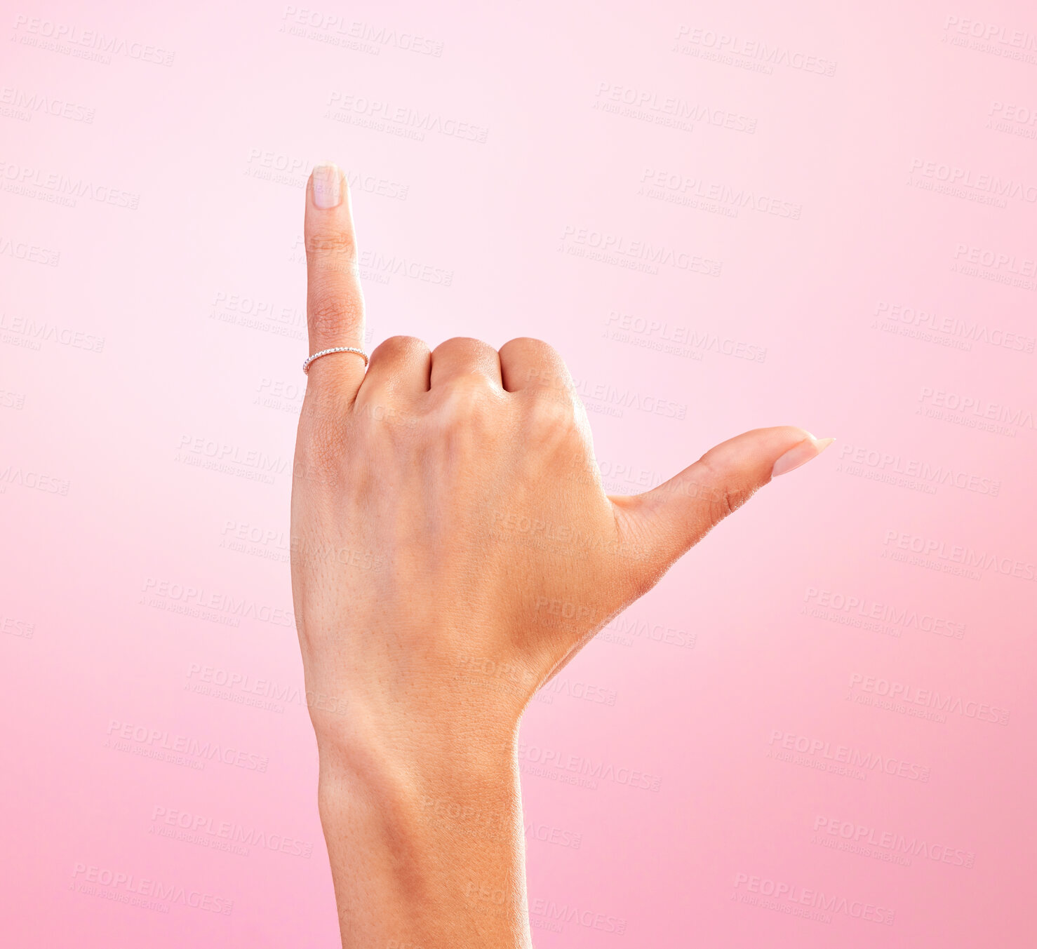 Buy stock photo Woman hand, shaka and studio with a icon, emoji and hang ten surfing sign. Isolated, pink background and female hands showing winner, surf and motivation signal with mockup and winning gesture