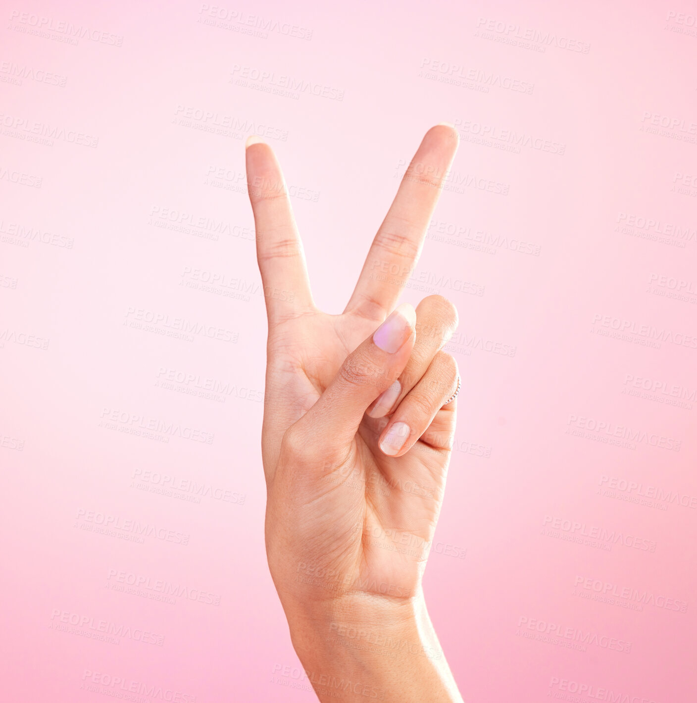 Buy stock photo Woman, hands and peace sign, emoji or symbol for freedom against a pink studio background. Hand of female showing peaceful V icon or shape for hope, support or trust in vote or voice on mockup