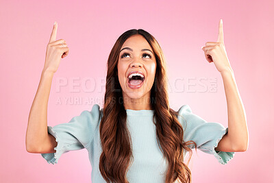 Buy stock photo Excited, pointing mockup and woman on pink background with happy, smile and space for sale, deal or discount. Advertising, hands and girl looking up for product placement, promotion and announcement