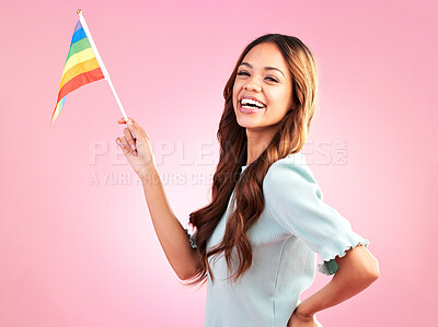 Buy stock photo LGBT, pride portrait or happy woman with rainbow flag for self love, individuality or LGBTQ community support. Equality, human rights girl or studio bisexual, gay or lesbian person on pink background