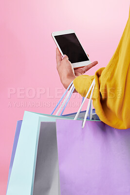 Buy stock photo Phone screen, shopping bag and hands of woman isolated on pink background online shopping, ecommerce and retail. Fashion person on mobile app, cellphone or smartphone for mockup space in studio
