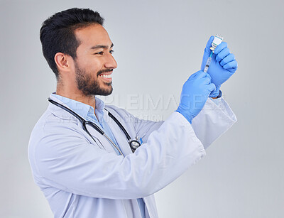 Buy stock photo Covid, vaccine and happy man doctor in studio, excited for medicine, breakthrough or cure on grey background. Medical, innovation and face of male corona expert with futuristic health treatment