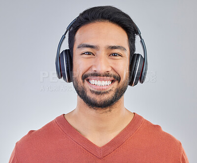 Buy stock photo Call center, portrait and man consultant in studio happy while working in crm, faq or telemarketing on grey background. Face, online, support and customer service agent consulting for virtual startup