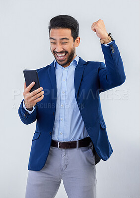 Buy stock photo Winner, yes and phone with man in studio for good news, success and bonus. Pride, excited and celebration with male and cheering isolated on gray background for achievement, pride and job promotion 