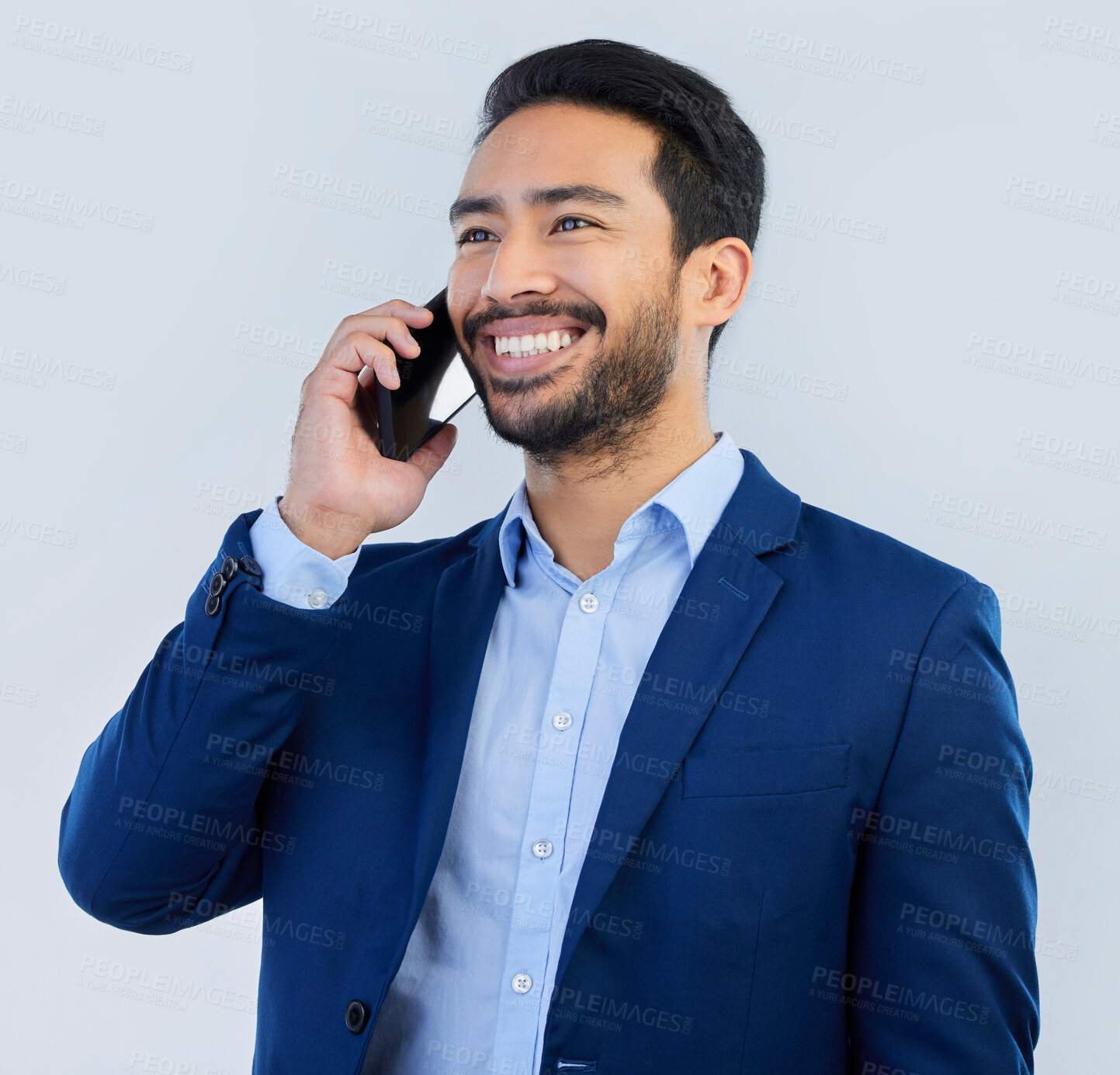 Buy stock photo Smile, smartphone and Indian man in studio, talking and networking on white background. Phone call, conversation and businessman in suit, communication and technology for investor trading at startup.