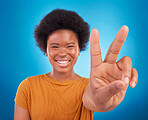 Peace sign closeup, black woman hand and portrait of a model with a smile and happiness. Isolated, blue background and v hands gesture of a young female with a afro and beauty feeling excited