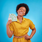 Black woman, money fan and smile in studio for winning, finance goal and success by blue background. Girl, happiness and cash in hand from casino, gambling and winner with wealth, rich and proud