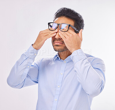 Buy stock photo Man in studio with glasses, rubbing eyes for vision, eyesight and tired on isolated on white background with burnout. Fatigue, stress and exhausted Indian businessman with prescription lens in frames
