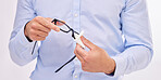 Hands, wipe glasses and cleaning in studio with man, eye health and fashion by white background. Businessman, spectacles and cloth for clean glass, vision and eyesight with frame for eyes by backdrop