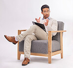 Psychology, psychologist and portrait of man on chair with clipboard in studio isolated on a white background. Therapist, consultant and male with checklist for therapy, mental health and counselling