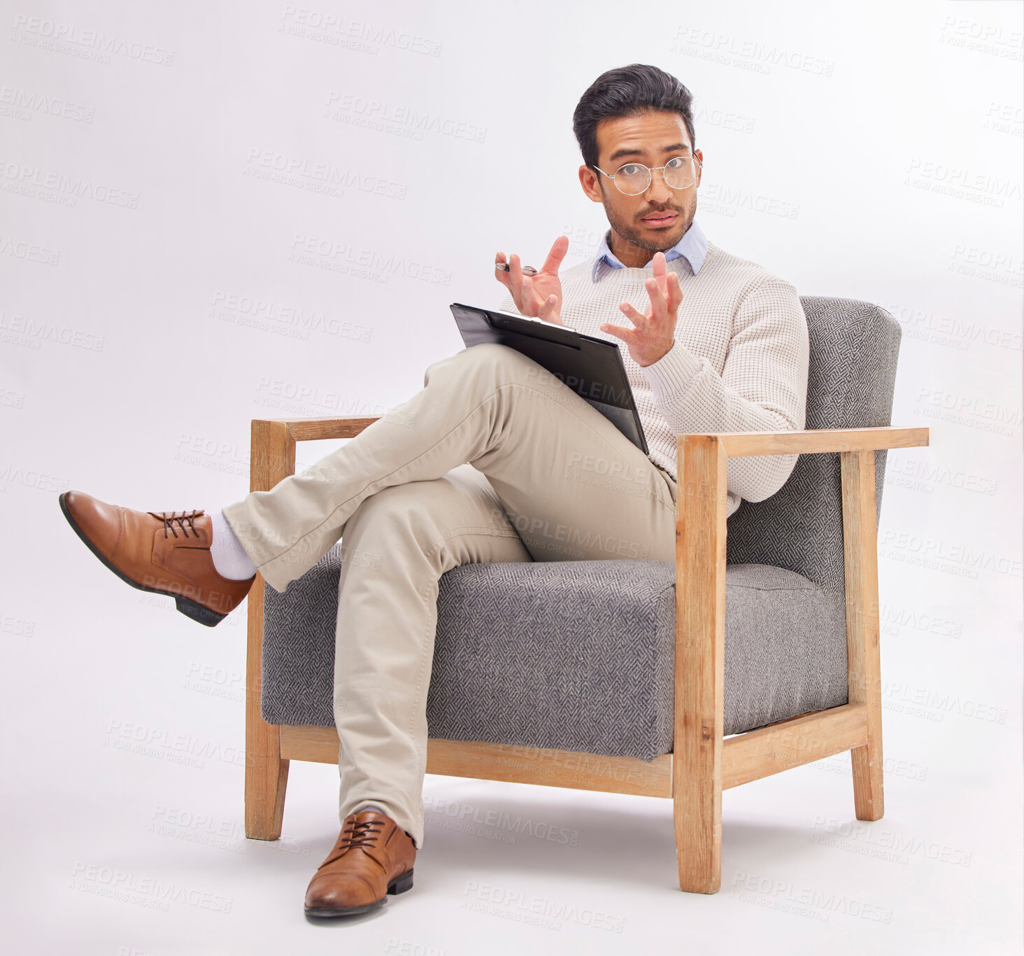 Buy stock photo Psychology, psychologist and portrait of man on chair with clipboard in studio isolated on a white background. Therapist, consultant and male with checklist for therapy, mental health and counselling