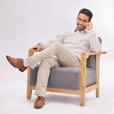 Buy stock photo Portrait, chair and a man therapist sitting in a studio on a gray background ready to listen during counselling. Therapy, consulting and health with a male psychologist working in rehabilitation