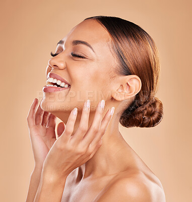 Buy stock photo Smile, beauty and a woman with hands on face for skin care glow and shine in studio on brown background. Aesthetic female model laugh and satisfied with spa facial, dermatology cosmetic and wellness 