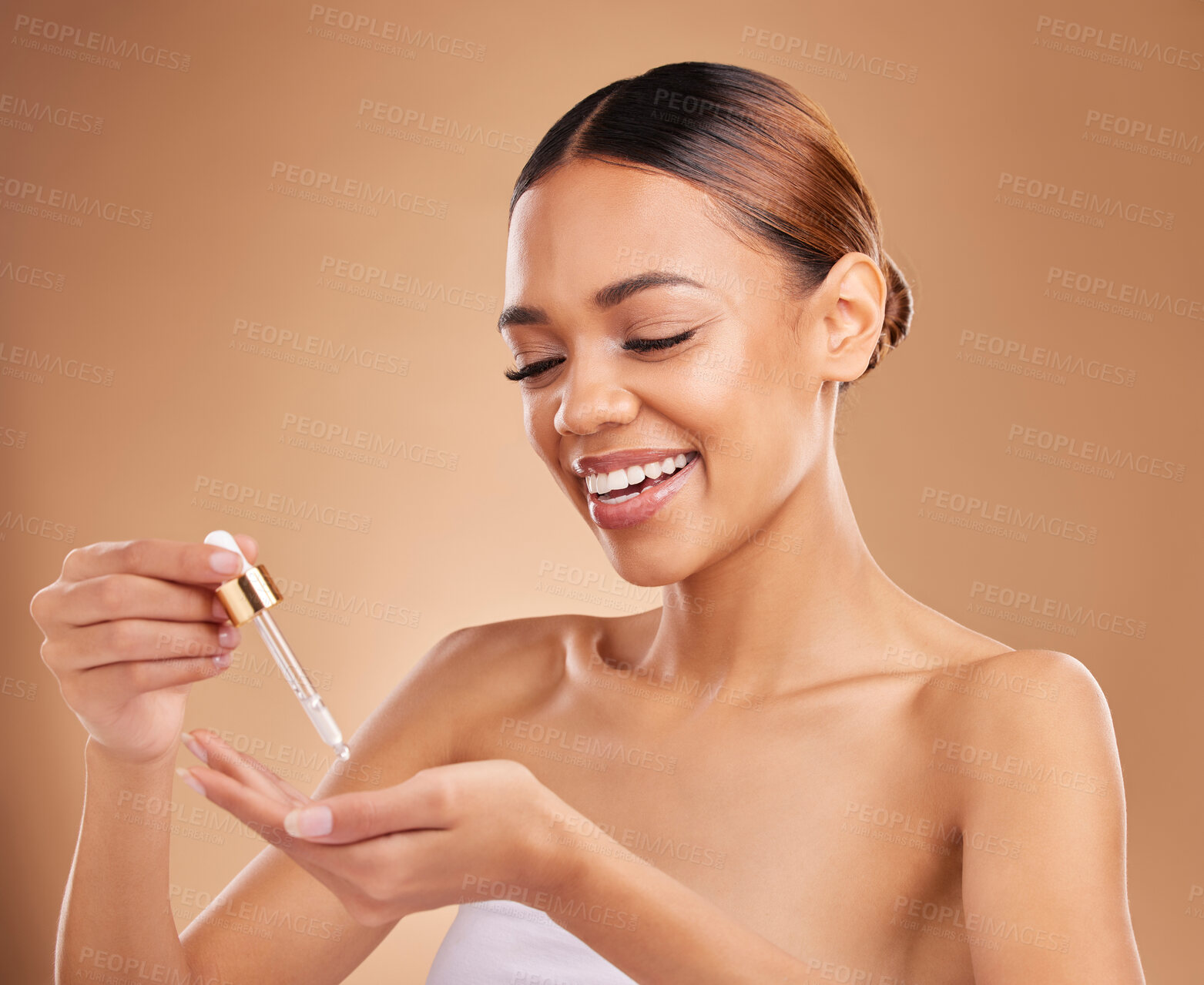 Buy stock photo Face oil, smile or happy woman in studio isolated on beige background for skincare hydration or beauty. Facial products, serum or funny natural girl laughing with glow or luxury self care cosmetics