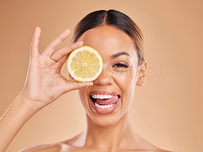 Buy stock photo Lemon, skincare and face of woman with smile in studio for wellness, facial treatment and natural cosmetics. Beauty, spa aesthetic and happy girl with fruit slice for detox, vitamin c and dermatology