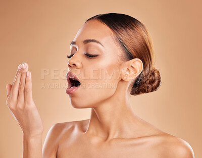 Buy stock photo Beauty, hygiene and bad breath with a model woman in studio on a brown background breathing into her hand. Skincare, dentist and face with an attractive young female smelling her mouth for freshness