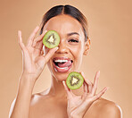 Skincare, kiwi and portrait of woman with smile in studio for wellness, organic facial and natural cosmetics. Beauty, dermatology spa and happy face girl with fruit for detox, vitamin c and nutrients