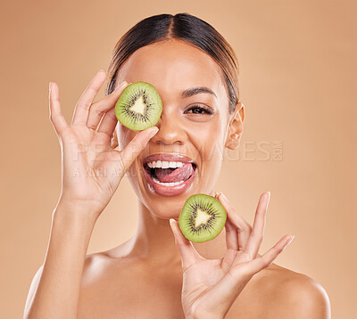 Buy stock photo Skincare, kiwi and portrait of woman with smile in studio for wellness, organic facial and natural cosmetics. Beauty, dermatology spa and happy face girl with fruit for detox, vitamin c and nutrients