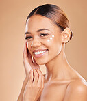 Face portrait, skincare and woman with cream in studio isolated on a brown background. Dermatology, beauty cosmetics and happy female model with lotion, creme or facial moisturizer of skin health.