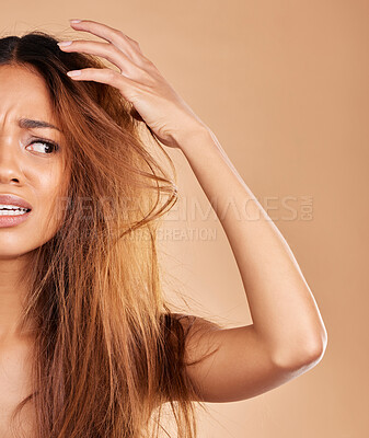 Buy stock photo Frizz, messy and woman with a bad hair day isolated on a studio background. Angry, beauty and half of a girl with a frizzy, damaged and tangled hairstyle, stress and frustrated with a salon perm