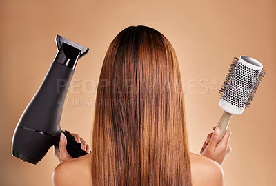 Buy stock photo Hair, styling and brush with hairdryer and woman in studio for beauty, grooming and salon blowout. Cosmetics, glamour and treatment with back of model on brown background for products, style or clean